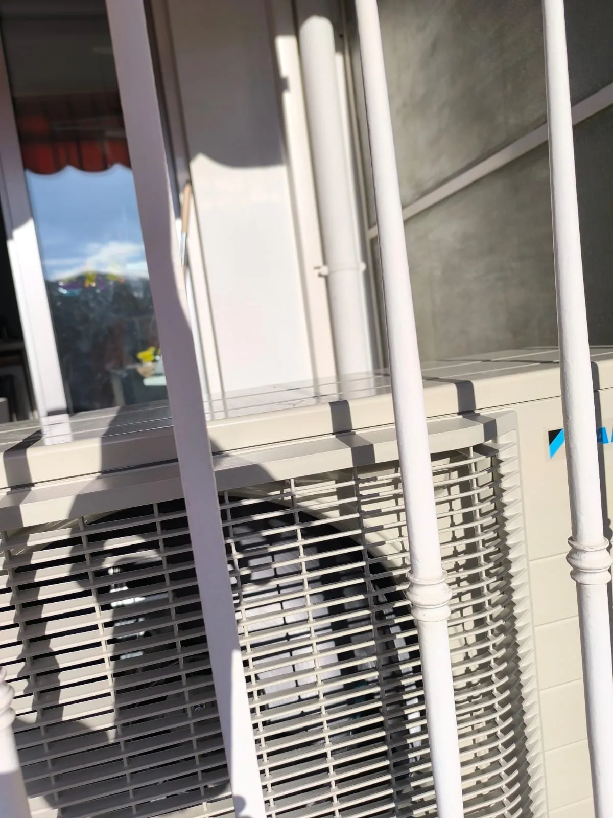 Daikin outdoor air conditioning unit on balcony in Nice Port - Close-up view