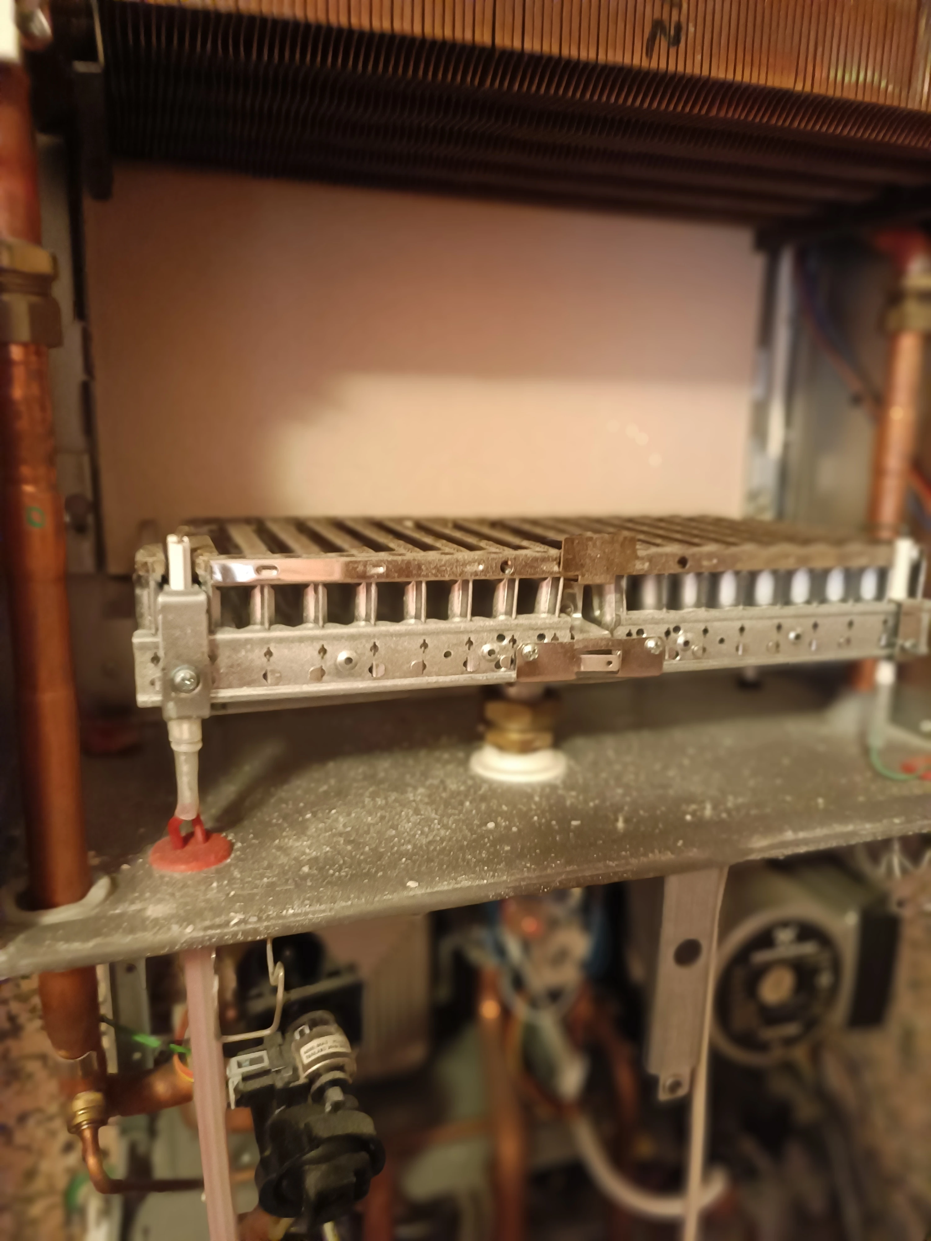 Boiler burner detail under maintenance in Nice Port - Chikhaoui Services Depannage Heating Engineer