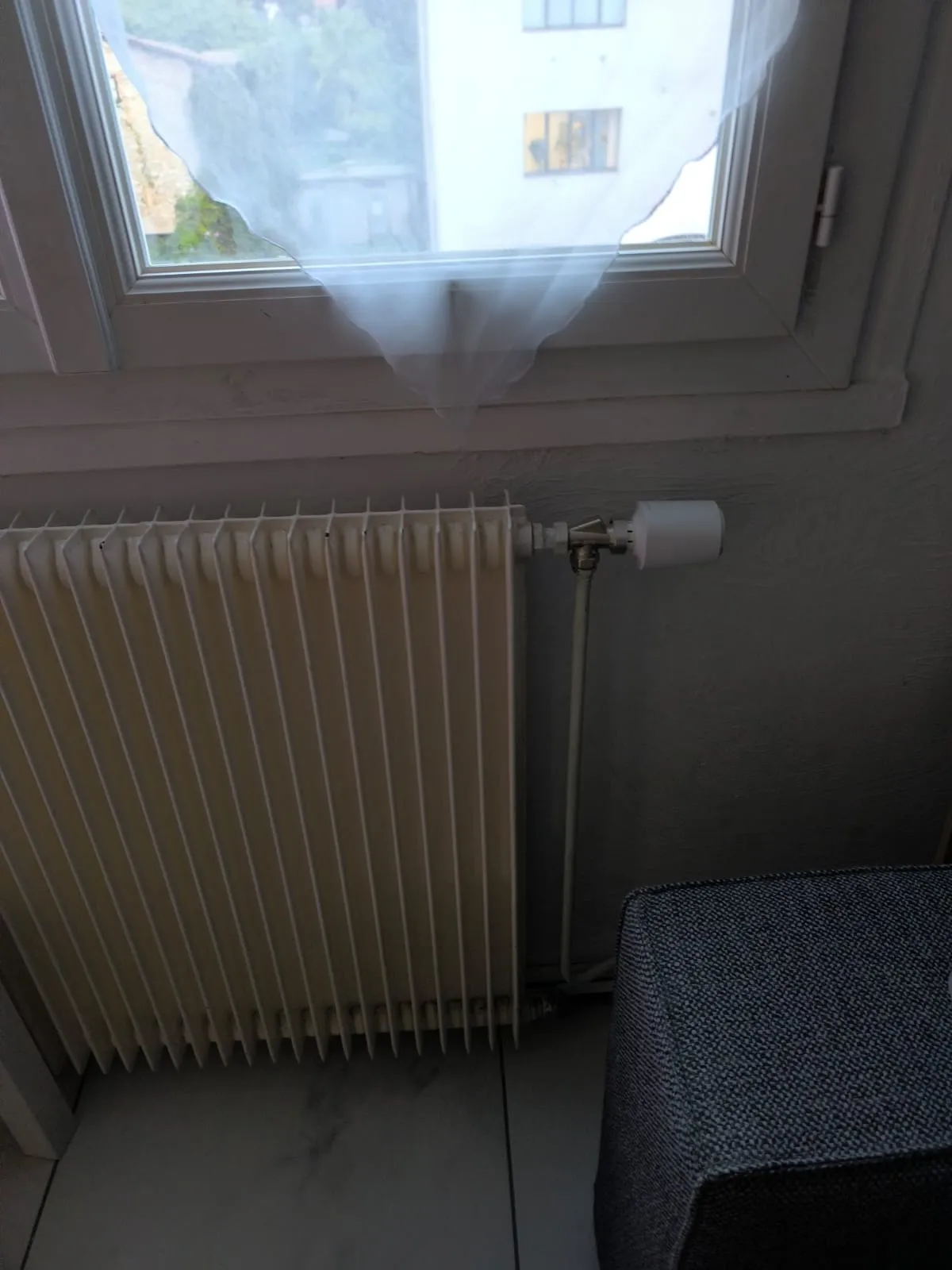 Kermi hot water radiator installed under window in Nice Carré d'Or - Chikhaoui Services Depannage Heating Engineer